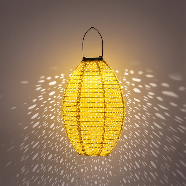 Billede af UDSALG - Dekorativ oval solcellelampe i i perforeret stof, i gylden orange farve - Udendørsbelysning > Solcellelamper > Dekorationsbelysning - Anna's Collection - Spotshop